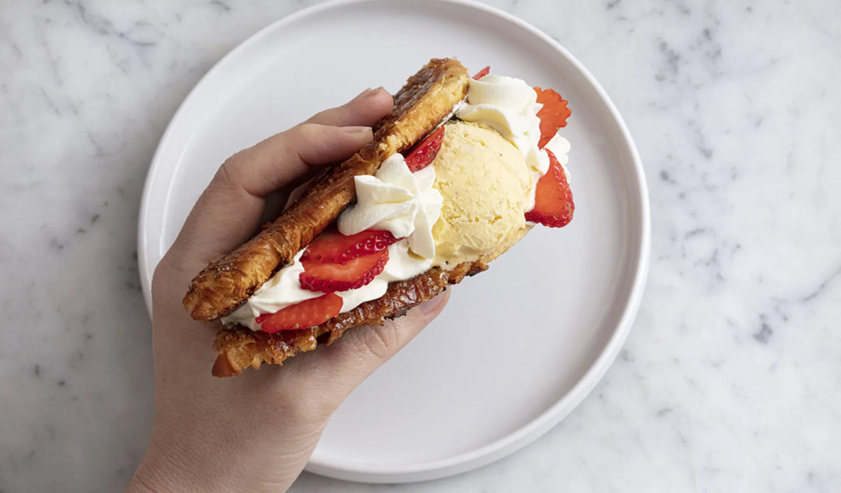 Délifrance ice cream croissant sandwich with strawberries and vanilla ice cream, plated for Singapore cafés
