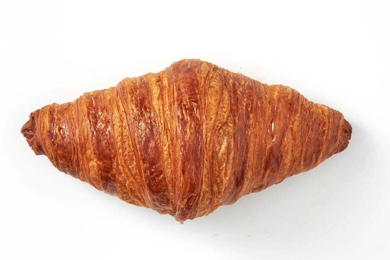 Croissant Singapore – Délifrance Le Passionné French butter croissant top view showing golden flaky pastry layers