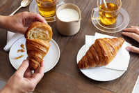 Croissant Singapore – Délifrance Le Passionné French butter croissant served with tea showing flaky layers and golden crust