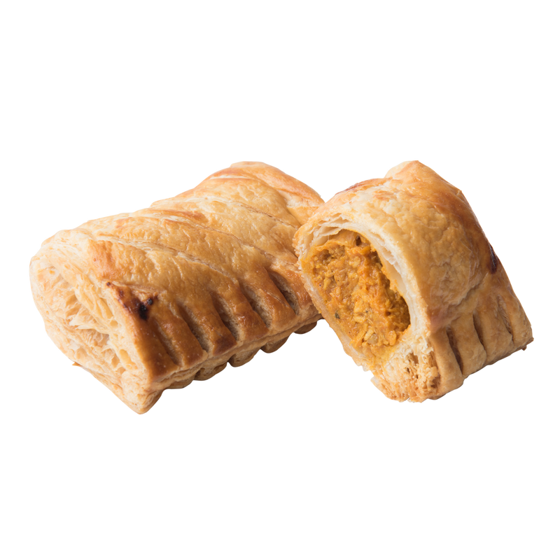 A close-up of Délifrance Chicken Curry Puffs, showing the golden-brown, flaky pastry and the flavorful chicken curry filling. Halal certified, made in Singapore