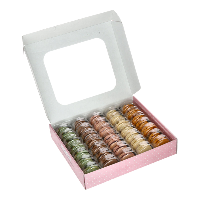 An open box of Délifrance Mini Macarons, revealing the five flavours: Chocolate, Pistachio, Raspberry, Vanilla, and Salted Butter Caramel. Gluten-free and Halal